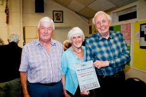 Keith Lamb receiving a special certificate after 10 years as leader